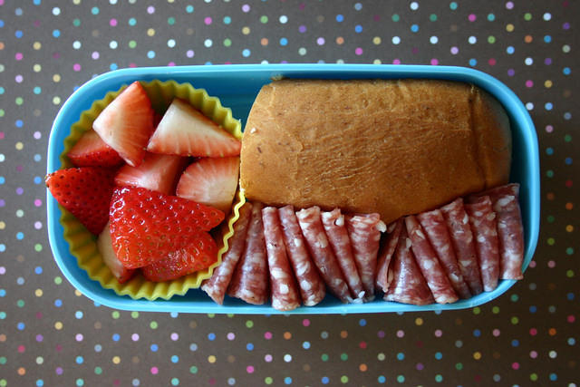 Wyatts favorite bento: salami, strawberries and a bun.