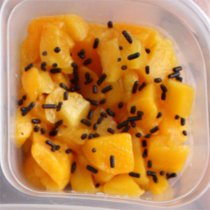 Add chocolate sprinkles to peaches -- plus 9 more ideas for fun Halloween lunches